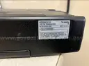 (1) 110-WATT TWO WAY RADIO, &#x26; (1) TRIPPLITE (SURGE PROTECTOR)