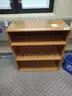Bookshelf, White Plastic File Cabinet, and Five-Drawer Vertical File Cabinet