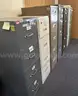 Lot of Seven (7)  4-drawer and 5-drawer Vertical Metal File Cabinets in various colors.