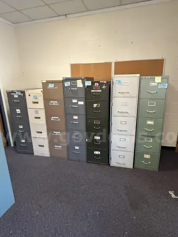 Lot of Seven (7)  4-drawer and 5-drawer Vertical Metal File Cabinets in various colors.