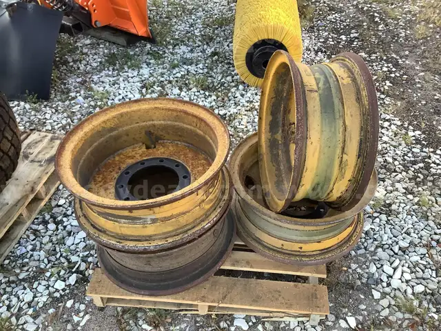 Four CAT 140 Grader Rims