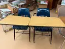 Coat rack, student desks, teacher desk, and more