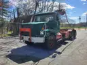 1999 VOLVO WG64 ROLL-OFF