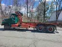 1999 VOLVO WG64 ROLL-OFF