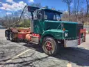1999 VOLVO WG64 ROLL-OFF