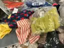 Apparel: &#x22;Clothes&#x22; (SEP25-0452)