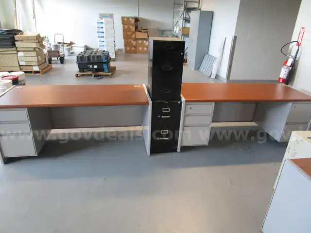 (2) USED STEELCASE DESKS; (2) USED VERTICAL FILE CABINETS