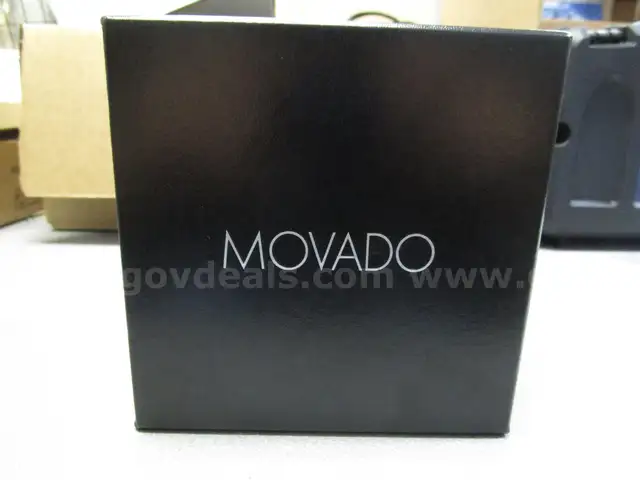 (1) NEW-IN-BOX MOVADO, 2-HAND WATCH BRACLET WITH OPERATION MANUAL
