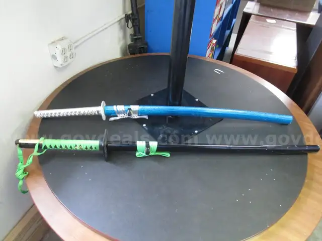 (2) USED STYLIZED KATANAS W/ SHEATHS