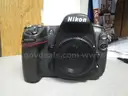 (1) USED BLACK, NIKON DIGITAL CAMERA D300, BODY ONLY; (1) USED BLACK, VIVITAR SERIES 1 FLASH ATTACHMENT, DF-383-NIK