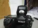 (1) USED BLACK, NIKON DIGITAL CAMERA D300, BODY ONLY; (1) USED BLACK, VIVITAR SERIES 1 FLASH ATTACHMENT, DF-383-NIK