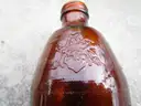 (18) USED GLASS BOTTLES; (1) USED PULL-TAB CAN