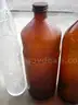 (18) USED GLASS BOTTLES; (1) USED PULL-TAB CAN