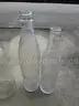 (18) USED GLASS BOTTLES; (1) USED PULL-TAB CAN