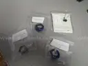 (3) USED RINGS AND (1) UNUSED NECKLACE
