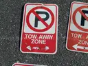 USED (6) TOW AWAY ZONE SIGNS, (3) CAUTION SIGNS, (1) ALL WAY SIGN