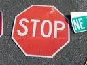 USED (3) TOW AWAY SIGNS, (4) STOP SIGNS, (1) SPEED HUMP SIGN, (1) STREET SIGN, (1) CAUTION SIGN