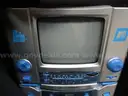 (1) USED CONCOURSE SUITCASE WITH THE SINGING MACHINE KARAOKE, STVG-700 &#x26; A MICROPHONE INSIDE