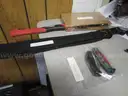(1) USED 18&#x22; BLADE MATCHETE IN A BLACK SHEATH; (2) USED FOLDING KNIVES; (1) USED HATCHET
