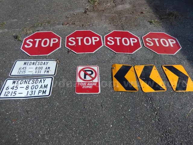 USED (4) STOP SIGNS, (3) CAUTION SIGNS, (2) WEDNESDAY TIME LISTED SIGNS, (1) TOW AWAY ZONE SIGN