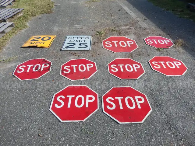 USED (8) STOP SIGNS, (1) 25 SPEED LIMIT SIGN, (1) 20 MPH SIGN