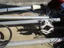 (8) USED METAL POLES; (4) HAVE CAMERAS ATTACHED