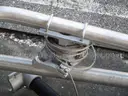 (8) USED METAL POLES; (4) HAVE CAMERAS ATTACHED
