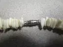 BAG OF VARIOUS USED COSTUME JEWELRY