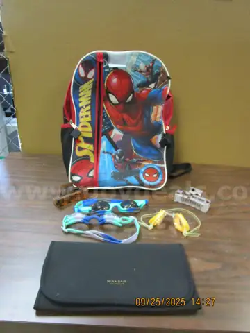 (1) USED SPIDERMAN BACKPACK W/MAGNETIC CHANGING PAD, SWIM GOGGLES & HAIR CLIPS.