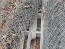 USED (6) BUNDLES OF CHAIN LINK OR CATTLE FENCING, (2) CHAIN LINK FENCING POSTS, (1) BOX OF ASSORTED FENCING HARDWARE