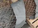 USED (6) BUNDLES OF CHAIN LINK OR CATTLE FENCING, (2) CHAIN LINK FENCING POSTS, (1) BOX OF ASSORTED FENCING HARDWARE