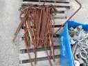 USED (6) BUNDLES OF CHAIN LINK OR CATTLE FENCING, (2) CHAIN LINK FENCING POSTS, (1) BOX OF ASSORTED FENCING HARDWARE