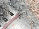 USED (6) BUNDLES OF CHAIN LINK OR CATTLE FENCING, (2) CHAIN LINK FENCING POSTS, (1) BOX OF ASSORTED FENCING HARDWARE