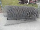USED (6) BUNDLES OF CHAIN LINK OR CATTLE FENCING, (2) CHAIN LINK FENCING POSTS, (1) BOX OF ASSORTED FENCING HARDWARE