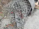 USED (6) BUNDLES OF CHAIN LINK OR CATTLE FENCING, (2) CHAIN LINK FENCING POSTS, (1) BOX OF ASSORTED FENCING HARDWARE