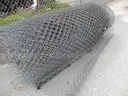 USED (6) BUNDLES OF CHAIN LINK OR CATTLE FENCING, (2) CHAIN LINK FENCING POSTS, (1) BOX OF ASSORTED FENCING HARDWARE