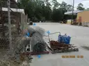 USED (6) BUNDLES OF CHAIN LINK OR CATTLE FENCING, (2) CHAIN LINK FENCING POSTS, (1) BOX OF ASSORTED FENCING HARDWARE