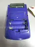 (1) USED PURPLE GAMEBOY COLOR, FOR PARTS OR REPAIR