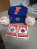 (1) UNUSED FLORIDA CAP; (2) UNUSED BASEBALLS; (2) UNOPENED PACKS OF PLAYING CARDS
