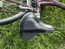 USED (1) WHITE BIKE, (1) RALEIGH PASSAGE BIKE, (1) RALEIGH PASSAGE BIKE, (1) RALEIGH PASSAGE BIKE