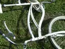 USED (1) WHITE BIKE, (1) RALEIGH PASSAGE BIKE, (1) RALEIGH PASSAGE BIKE, (1) RALEIGH PASSAGE BIKE
