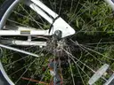 USED (1) WHITE BIKE, (1) RALEIGH PASSAGE BIKE, (1) RALEIGH PASSAGE BIKE, (1) RALEIGH PASSAGE BIKE