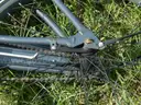 USED (1) WHITE BIKE, (1) RALEIGH PASSAGE BIKE, (1) RALEIGH PASSAGE BIKE, (1) RALEIGH PASSAGE BIKE