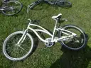 USED (1) WHITE BIKE, (1) RALEIGH PASSAGE BIKE, (1) RALEIGH PASSAGE BIKE, (1) RALEIGH PASSAGE BIKE