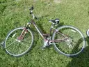USED (1) WHITE BIKE, (1) RALEIGH PASSAGE BIKE, (1) RALEIGH PASSAGE BIKE, (1) RALEIGH PASSAGE BIKE