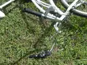 USED (1) WHITE BIKE, (1) RALEIGH PASSAGE BIKE, (1) RALEIGH PASSAGE BIKE, (1) RALEIGH PASSAGE BIKE