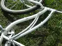 USED (1) WHITE BIKE, (1) RALEIGH PASSAGE BIKE, (1) RALEIGH PASSAGE BIKE, (1) RALEIGH PASSAGE BIKE