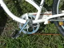 USED (1) WHITE BIKE, (1) RALEIGH PASSAGE BIKE, (1) RALEIGH PASSAGE BIKE, (1) RALEIGH PASSAGE BIKE
