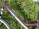USED (1) WHITE BIKE, (1) RALEIGH PASSAGE BIKE, (1) RALEIGH PASSAGE BIKE, (1) RALEIGH PASSAGE BIKE