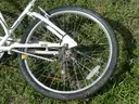 USED (1) WHITE BIKE, (1) RALEIGH PASSAGE BIKE, (1) RALEIGH PASSAGE BIKE, (1) RALEIGH PASSAGE BIKE
